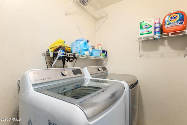 laundry area featuring laundry area and washing machine and clothes dryer