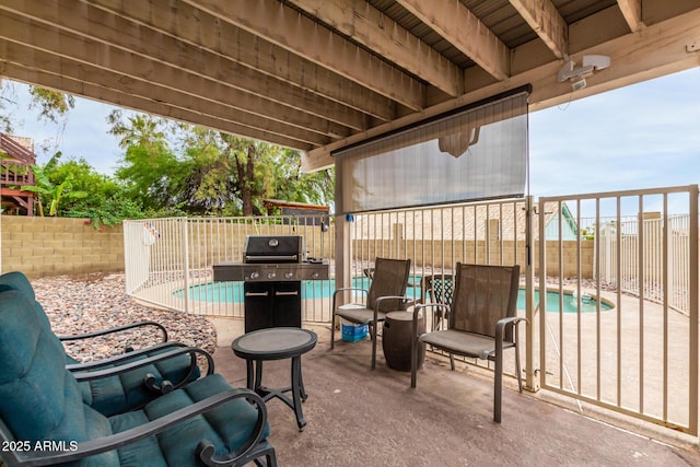 view of patio featuring a fenced backyard, a grill, and a fenced in pool