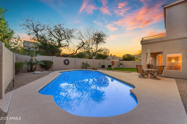 view of swimming pool featuring a patio area, a fenced backyard, and a fenced in pool