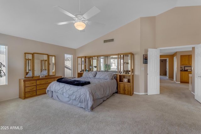 bedroom with light carpet, multiple windows, and visible vents