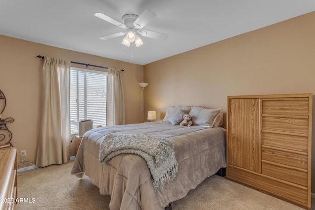 bedroom featuring ceiling fan and light colored carpet