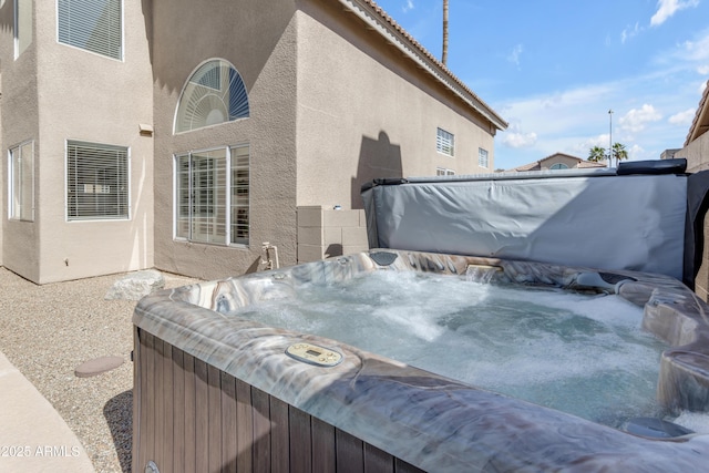 exterior space featuring a hot tub