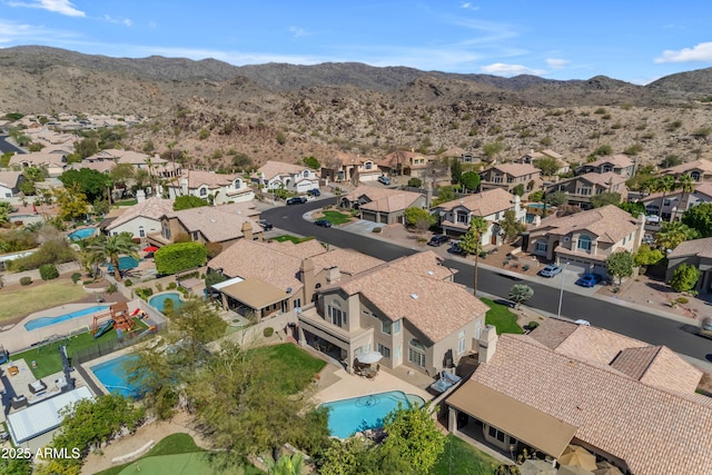 drone / aerial view with a residential view and a mountain view