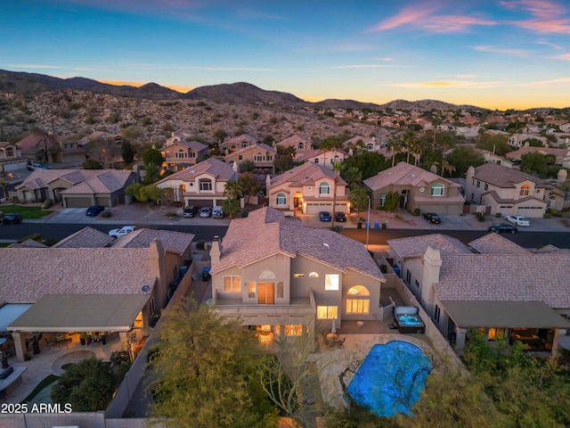 drone / aerial view with a residential view and a mountain view