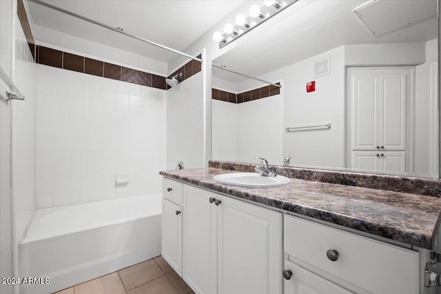 bathroom with vanity, tile patterned floors, and tiled shower / bath combo