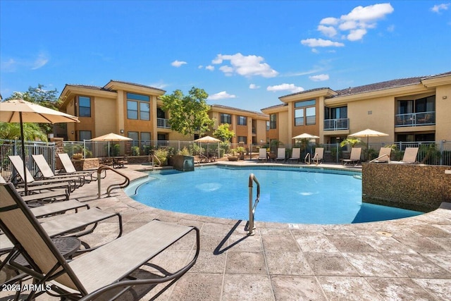 view of pool featuring a patio area and pool water feature