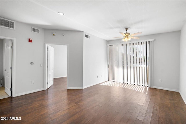 unfurnished room featuring ceiling fan and dark wood-type flooring