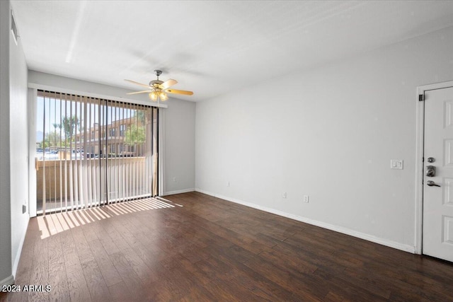 unfurnished room with ceiling fan and dark hardwood / wood-style floors