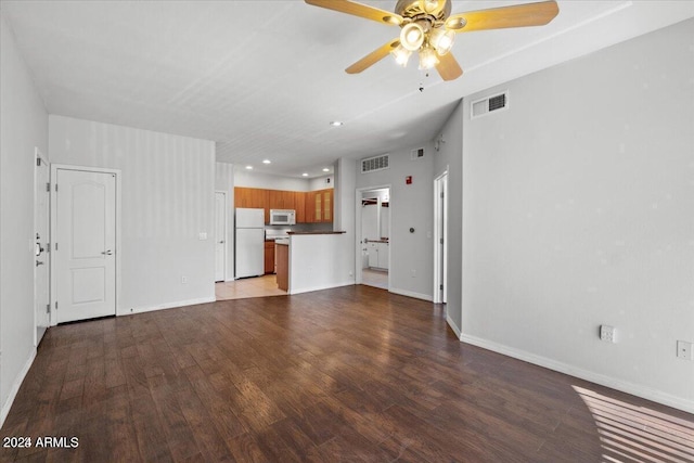 unfurnished living room featuring ceiling fan and light hardwood / wood-style floors