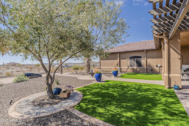 view of yard featuring a patio and a pergola