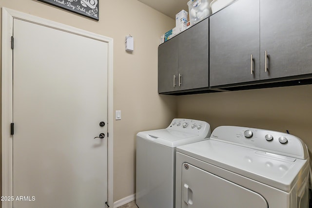 laundry room featuring cabinet space and washer and dryer