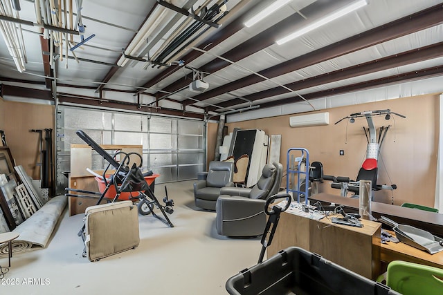 garage with a garage door opener and a wall mounted AC