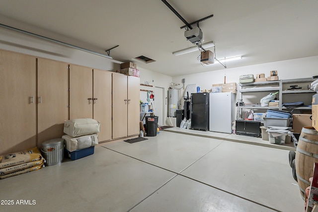 garage with water heater and a garage door opener