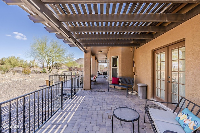 view of patio with a pergola and french doors