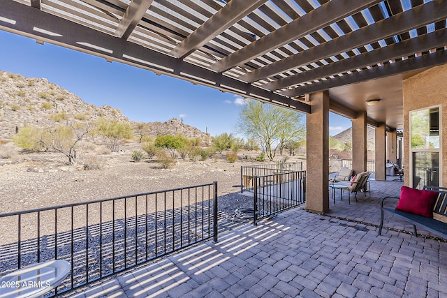 view of patio with fence and a pergola