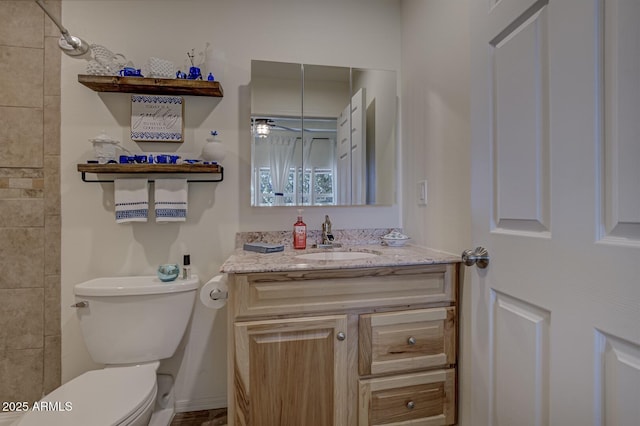 4090 N Cherri Lynn Dr, Pine, AZ 85544 - bathroom featuring toilet, vanity, a ceiling fan, and baseboards