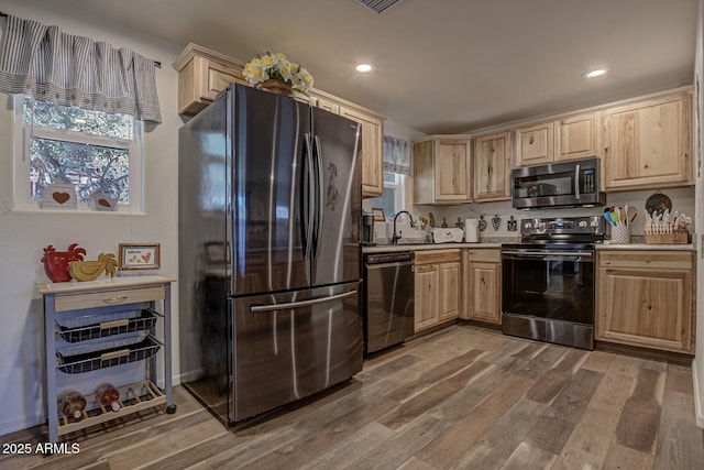 4090 N Cherri Lynn Dr, Pine, AZ 85544 - kitchen featuring stainless steel appliances, light brown cabinetry, light countertops, wood finished floors, and plenty of natural light