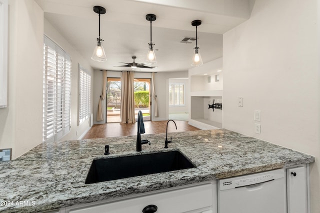 kitchen with ceiling fan, sink, white dishwasher, pendant lighting, and hardwood / wood-style flooring