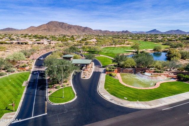 drone / aerial view with a water and mountain view