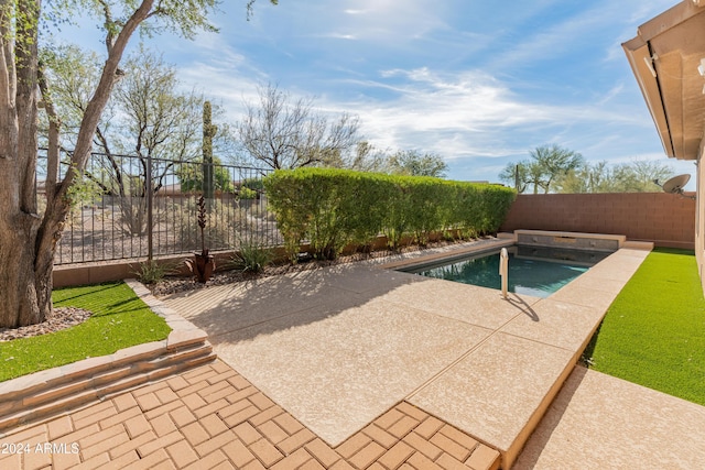 view of pool featuring a patio