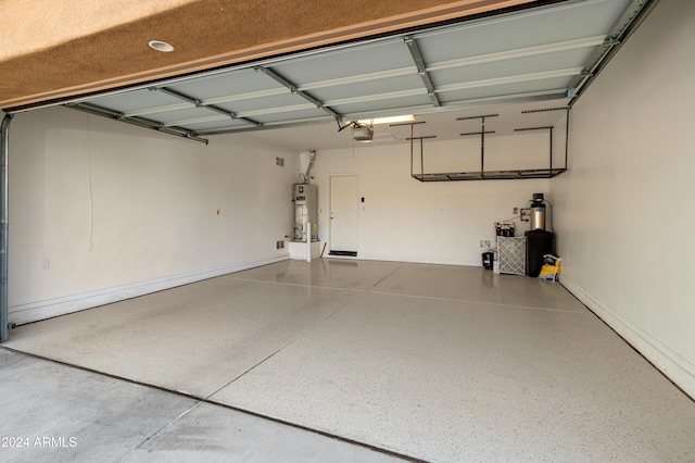 garage with a garage door opener and gas water heater