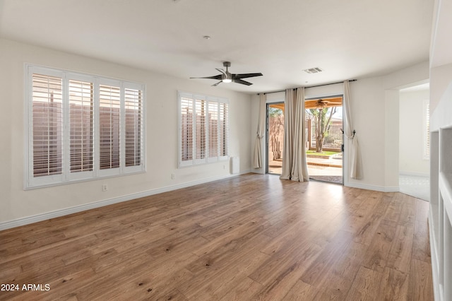 unfurnished room featuring ceiling fan and wood-type flooring