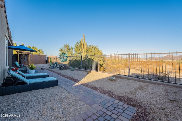 view of yard with a view of the beach, a water view, and a patio area