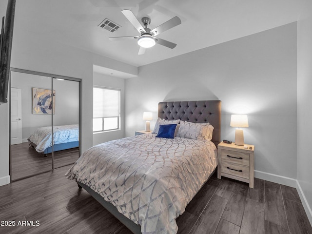 14000 N 94th St Unit 1008, Scottsdale, AZ 85260 - bedroom with a ceiling fan, a closet, baseboards, dark wood-style flooring, and visible vents