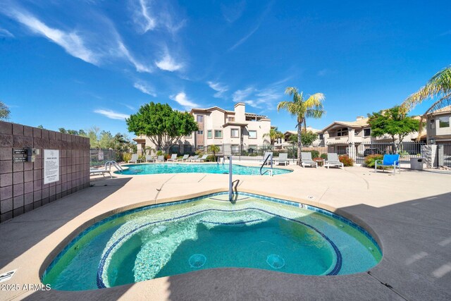 14000 N 94th St Unit 1008, Scottsdale, AZ 85260 - community pool featuring a residential view, a patio, and fence
