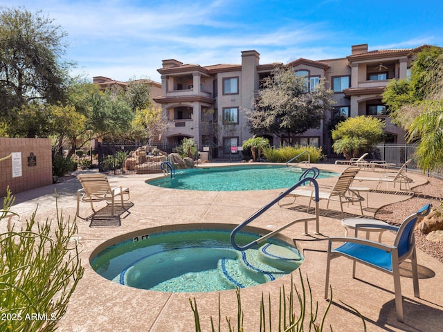 14000 N 94th St Unit 1008, Scottsdale, AZ 85260 - community pool with fence, a hot tub, and a patio