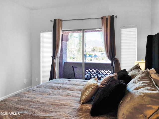 14000 N 94th St Unit 1008, Scottsdale, AZ 85260 - bedroom featuring access to exterior and baseboards