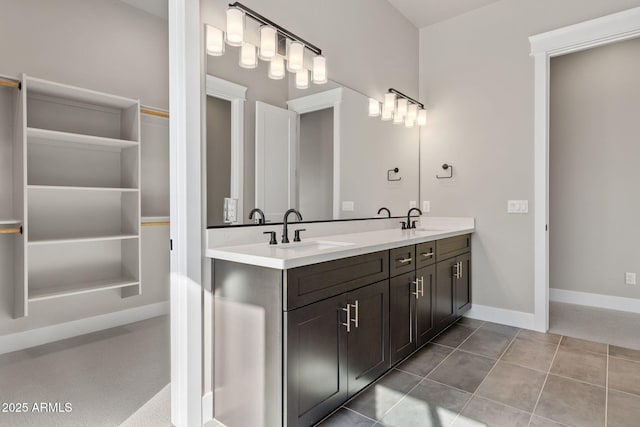 bathroom featuring tile patterned flooring and vanity