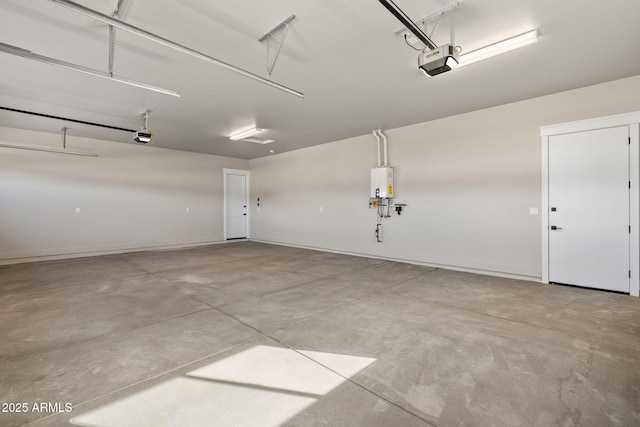 garage with a garage door opener and water heater