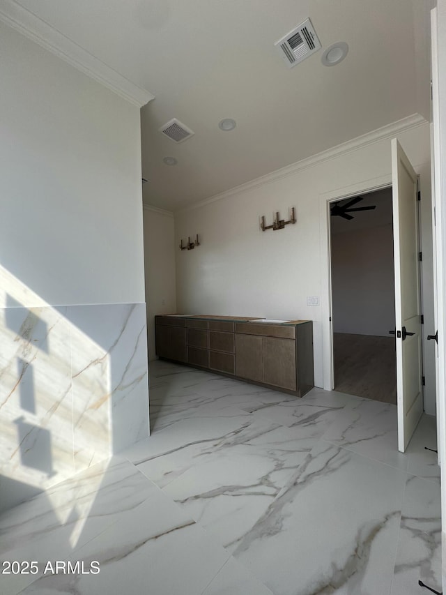 bathroom featuring visible vents, marble finish floor, and ornamental molding