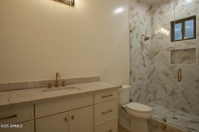 full bathroom with vanity, toilet, and a marble finish shower