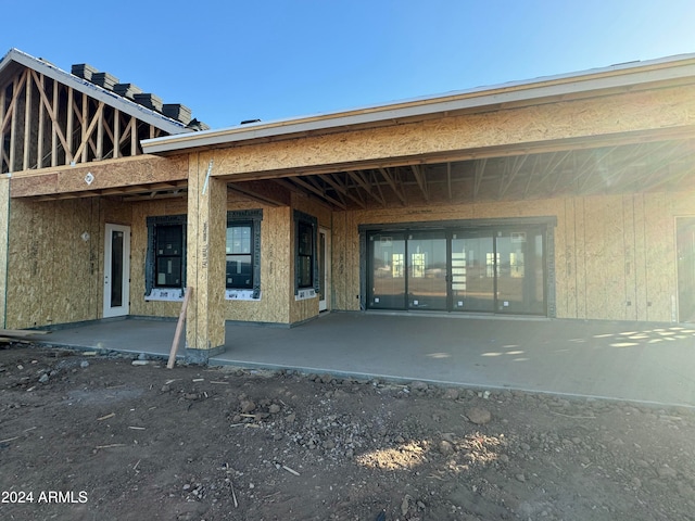 rear view of property with a patio area