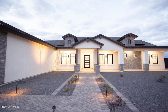 modern inspired farmhouse featuring stucco siding