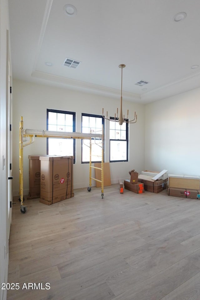 unfurnished dining area with visible vents and wood finished floors