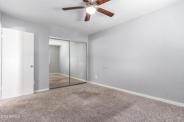 unfurnished bedroom with a closet, ceiling fan, and carpet