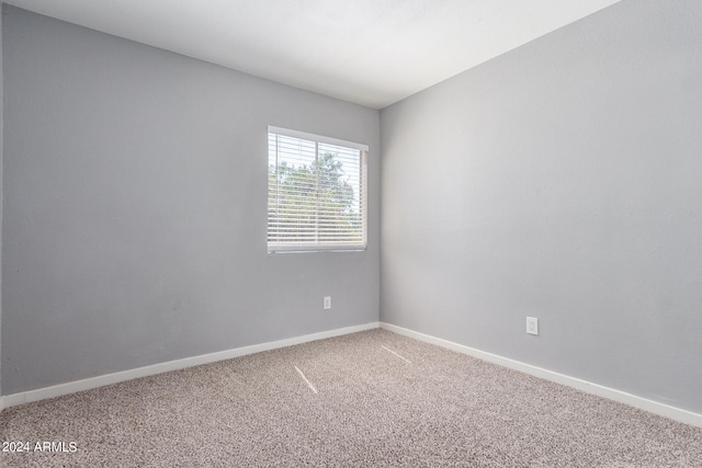 unfurnished room featuring carpet floors