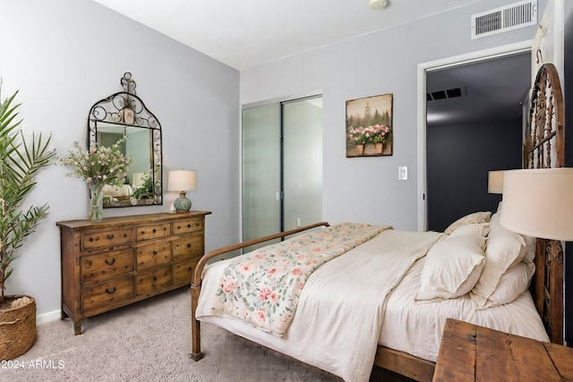 carpeted bedroom featuring a closet