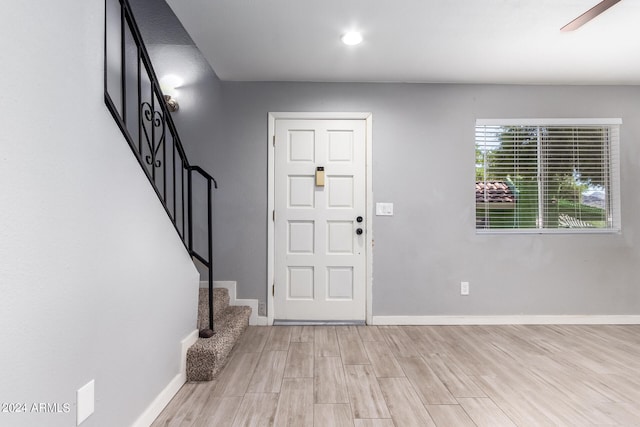 entrance foyer featuring light hardwood / wood-style flooring and ceiling fan