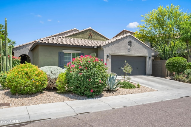 3766 E Ringtail Way, Phoenix, AZ 85050 - view of front facade with an attached garage, stucco siding, driveway, and a tiled roof