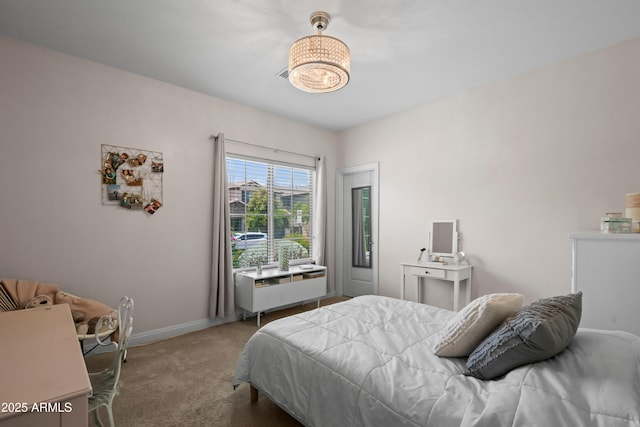 3766 E Ringtail Way, Phoenix, AZ 85050 - carpeted bedroom featuring a chandelier and baseboards