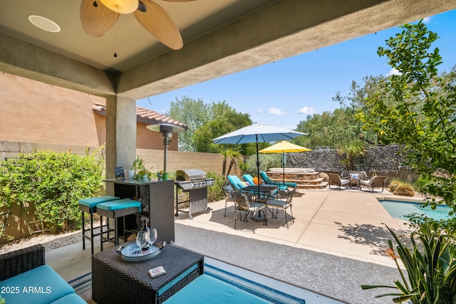 3766 E Ringtail Way, Phoenix, AZ 85050 - fenced backyard with a patio area, an outdoor bar, a hot tub, and a ceiling fan