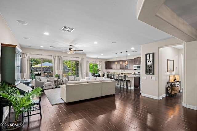 3766 E Ringtail Way, Phoenix, AZ 85050 - living area with ceiling fan, plenty of natural light, dark wood-style flooring, and recessed lighting