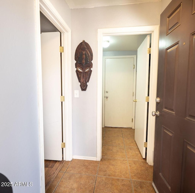 hall featuring tile patterned floors