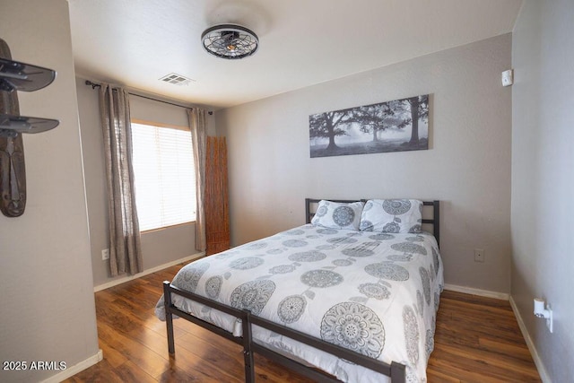 bedroom featuring dark hardwood / wood-style flooring