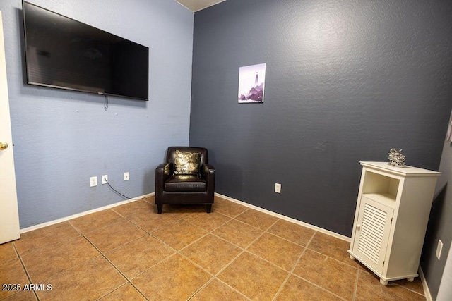 sitting room featuring tile patterned floors