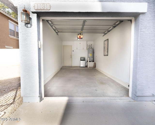 garage featuring a garage door opener and water heater